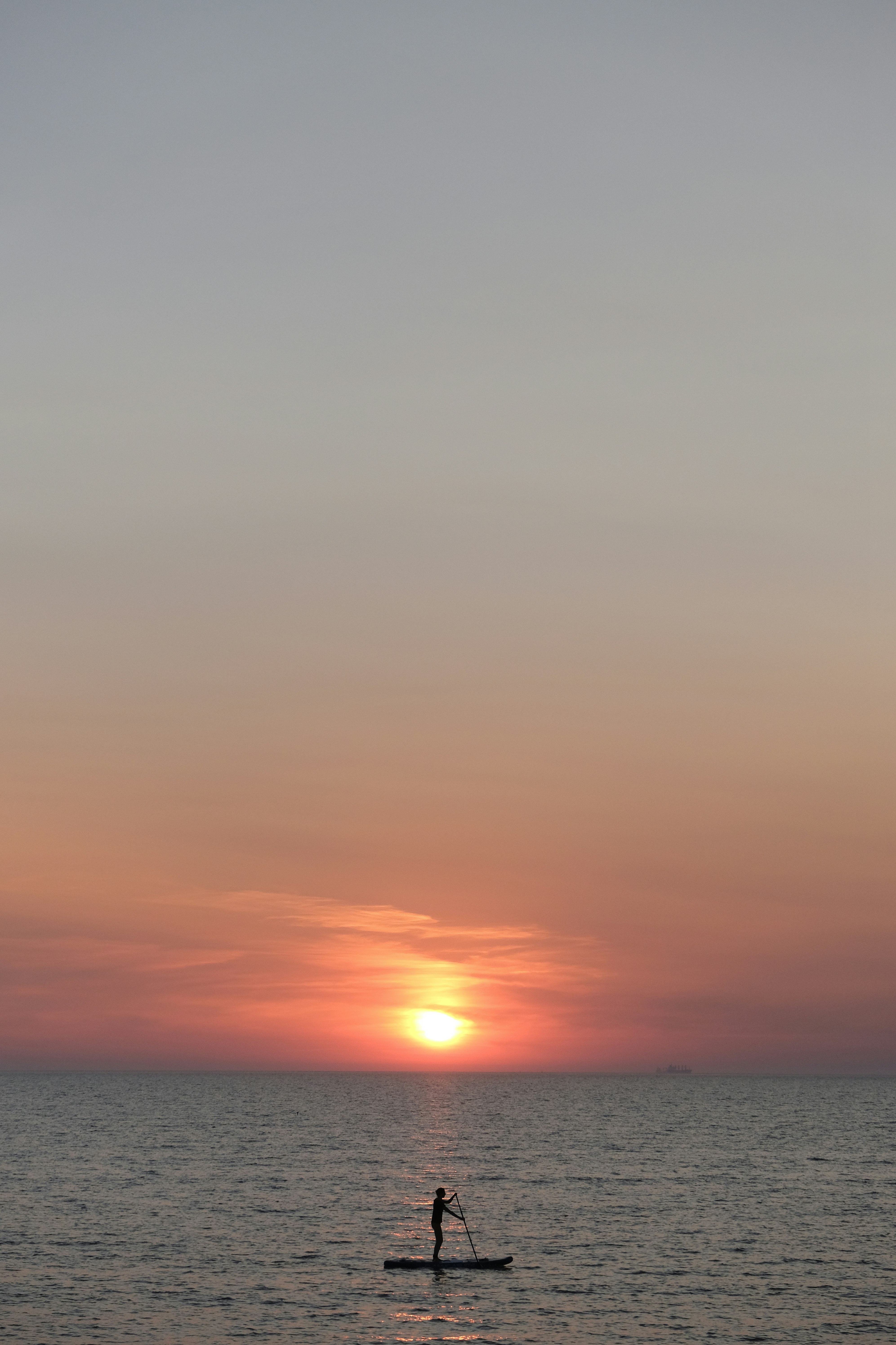 body of water during sunset